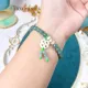 Vòng tay đá Cẩm Thạch tự nhiên băng chủng Lam Ngọc VIP size 6.8 li phối charm cỏ 4 lá bạch ngọc, bánh xe cẩm thạch | Hoa Minh Gem. 