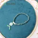 Vòng tay đá Cẩm Thạch tự nhiên băng chủng Lam Ngọc VIP size 6.8 li phối charm cỏ 4 lá bạch ngọc, bánh xe cẩm thạch | Hoa Minh Gem. 